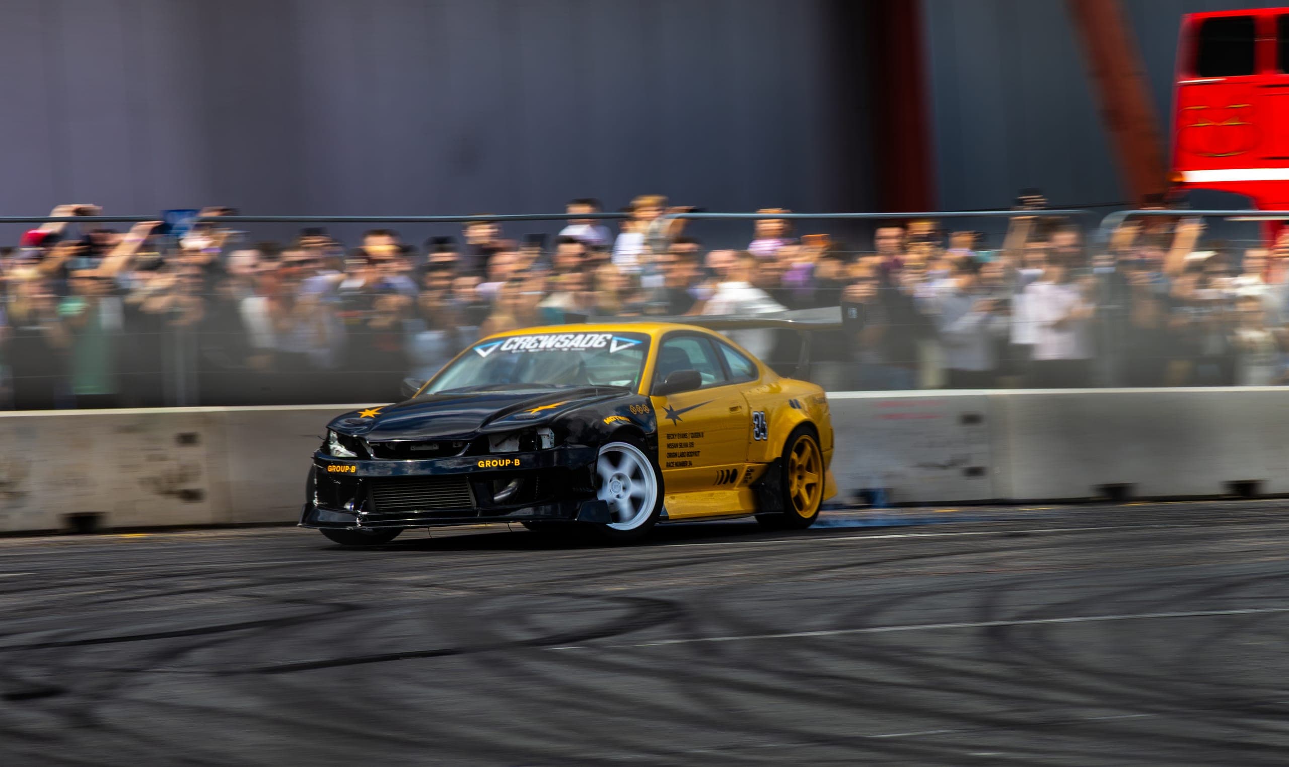 A drift car sideways past a full grandstand, Gravity 2026