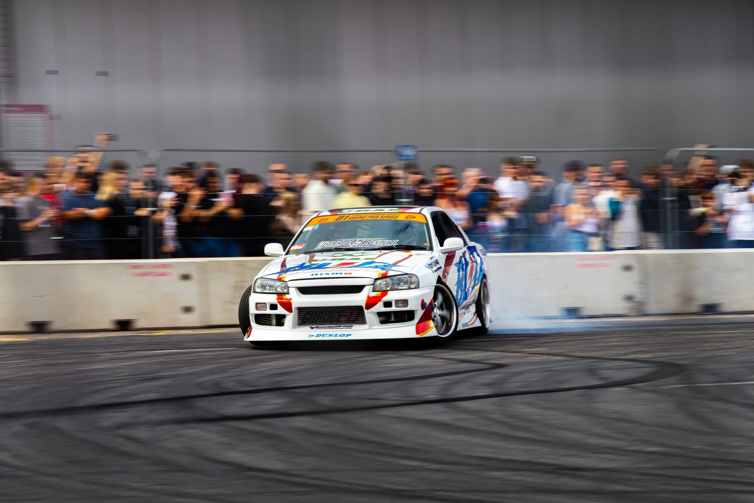 A liveried drift car on its last run of the day, Gravity 2026